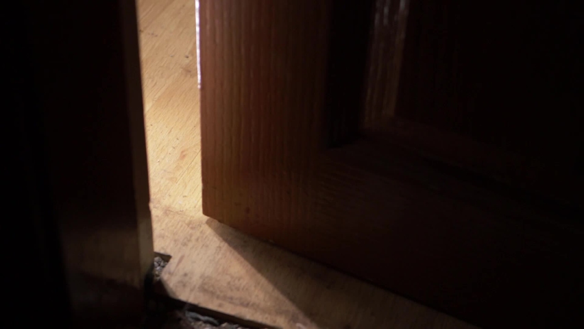 Wooden door slowly opening into room low medium shot | Shutterstock HD Video #1077406472