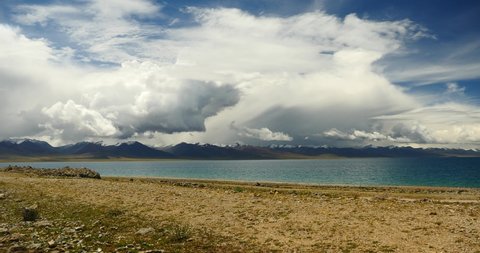 4k time lapse of huge clouds mass rolling over lake namtso  Tanggula snow mountain peak,tibet mansarovar,Tibet's second largest lake,is the third largest saltwater lake in China.Danggula(Tanggula) 