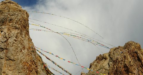 4k Prayer flags at the lake namtso in tibet,ancient holy monk meditation in cave,ZhaXi Peninsula,tibet mansarovar,Tibet's second largest lake,is the third largest saltwater lake in China.Danggula