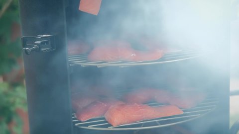 Smoking fish, The smokehouse door are closed and a lot of smoke comes from there