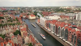 Gdansk,Poland,Europe.Beautiful panoramic aerial 4K video from drone to old city Gdansk, Motlawa river and Gothic St Mary church, city hall tower, the oldest medieval port crane (Zuraw) and old houses
