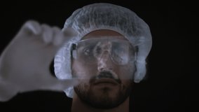 Male Scientist looking at a holographic genetic interface with patient information, 3D DNA model rotating and sequencing graph. Genomic Research, augmented reality, futuristic medicine.  - Powered by Shutterstock - Get 15% off with code: PIKWIZARD15