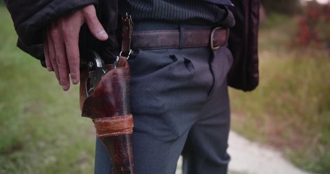 Closeup of a Cowboy Drawing Pistol In A Duel