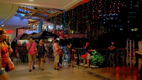 Cebu City , Philippines - 01 13 2020: Cebu City, Phil.; 13th Jan. 2020 -- Mallgoers enjoy a captivating outdoor light show as they walk along a promenade at Cebu Ayala Mall, during New Year 2020 seaso
