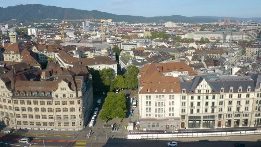 Zurich City Center during Morning Rush Hour, Historic Buildings. Aerial Sliding Shot 
