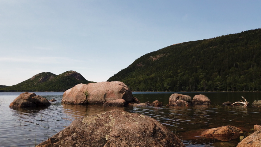 The glacier formed tarn Jordan Pond in Acadia National Park, Maine, USA, slow panning shot