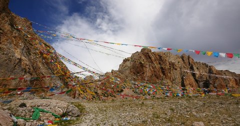 4k Prayer flags at the lake namtso in tibet,ancient holy monk meditation in cave,ZhaXi Peninsula,tibet mansarovar,Tibet's second largest lake,is the third largest saltwater lake in China.Danggula