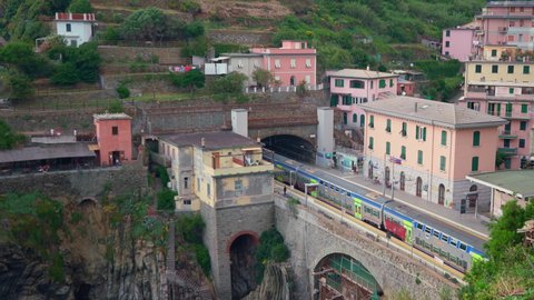 Riomaggiore, Italy - June 11. 2021: Trenitalia departing Train Station in Cinque Terre, Italy Passenger Train