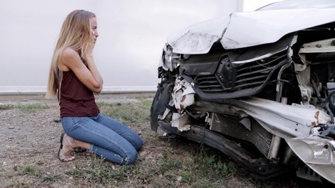 car crashed crying girl. loss of transport. vehicle. not safe driving.