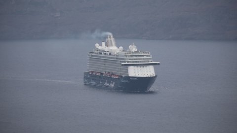 Santorini, Greece - September 18 2020: Aerial view over the German cruise ship "TUI Mein Schiff 6" sailing within the Caldera