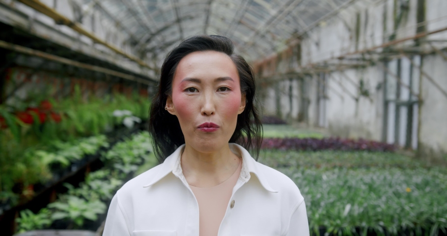 Portrait Beautiful asian girl with flower in her mouth 