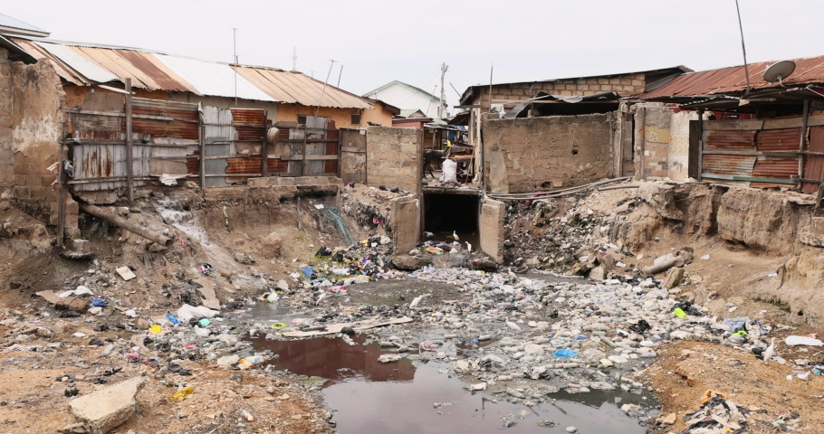 Nima Accra city environment pollution poverty neighborhood. West Africa on the Atlantic ocean. Many towns, villages communities polluted by trash, garbage and sewage. Royalty-Free Stock Footage #1077520049