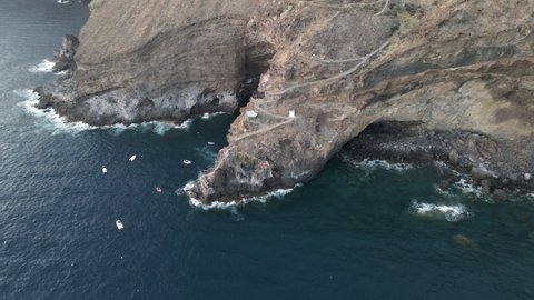 Unique aerial view of cliff trail of Poris de Candelaria, La Palma, Canary Islands, Spain; drone dolly-in tilt-down shot