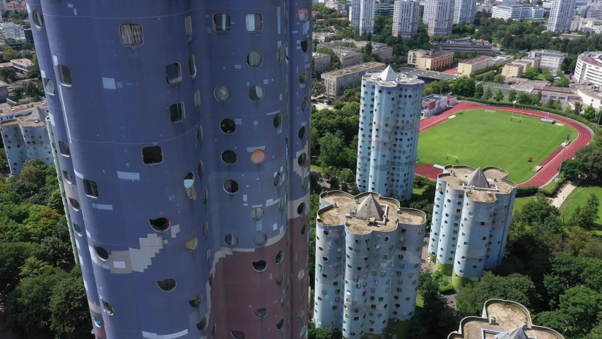 Nanterre, Paris suburbs, Hauts-de-Seine district, HLM buildings and skyscrapers "The Aillaud towers" in Picasso quarter before rehabilitation. Slow foreward drone aerial view. Royalty-Free Stock Footage #1077558197