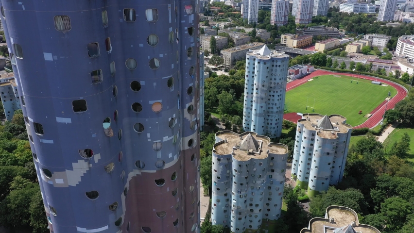 Nanterre, Paris suburbs, Hauts-de-Seine district, HLM buildings and skyscrapers "The Aillaud towers" in Picasso quarter before rehabilitation. Slow foreward drone aerial view. Royalty-Free Stock Footage #1077558197