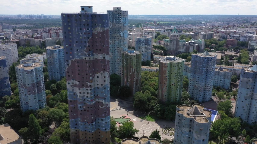Nanterre, Paris suburbs, Hauts-de-Seine district, HLM social housing buildings and skyscrapers "The Aillaud towers" in Picasso quarter before rehabilitation. Wide drone aerial view. Royalty-Free Stock Footage #1077558200
