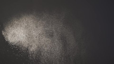 Water spray dust. Spraying mist effect. Perfume spray. Beauty light from perfume spraying. Hand spraying dust perfume, Slow motion. Applies perfume. Spraying fragrance with scent.