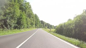 video footage of some motorbikes driving in summer on a twisting road in germany