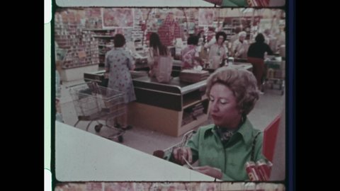 1970s Buffalo, NY, Housewife in Fashionable Green Coat buys Groceries from Supermarket Controller with early Electronic Funds Transfer. Interior of Retro Supermarket. 4K Overscan of Archival 16mm Film