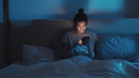 insomniac woman bedtime leisure phone online night