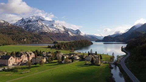 Aerial drone footage of the Sils village and lake in the stunning Engadine valley in the alps in Canton Graubunden (Grisons) in Switzerland