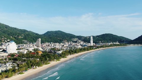 Beautiful seascape of popular beach tourist in summer day.Top view the best famous tourist Patong city in Phuket,Thailand.Drone view of  sunset over mountains. sea and sand.