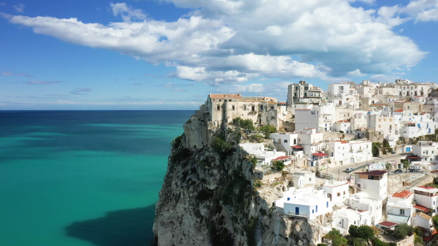 The castle of the town of Peschicia at the top of the cliff and at the edge of the Tyrrhenian sea in Europe, in Italy, in the region of Puglia, in the province of Foggia, in Peschici