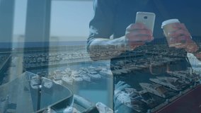 Animation of man using smartphone over cityscape. global business, communication and finance concept digitally generated video.