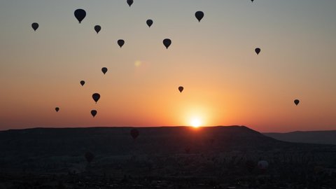 Air balloons flying in Goreme, Cappadokia. Kapadokya air balloons timelapse. Time lapse air balloons. A lot of aerostats in Turkey.