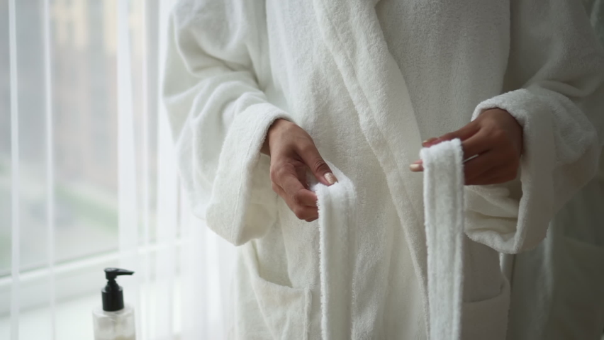 Beauty and spa procedures lady ties belt of bathrobe Spbd | Shutterstock HD Video #1077621920