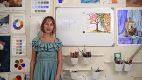 Art school distance learning teacher shows picture to camera Spbas