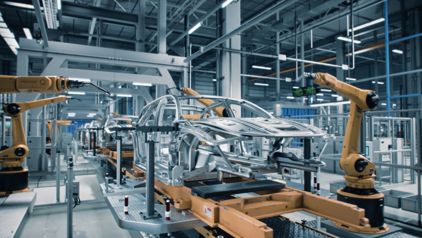 Car Factory 3D Concept: Automated Robot Arm Assembly Line Manufacturing Advanced High-Tech Green Energy Electric Vehicles. Construction, Building, Welding Industrial Production Conveyor. Close-up Royalty-Free Stock Footage #1077627425