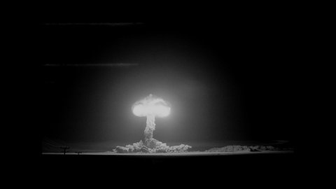 1940s: Atomic bomb explosion. Mushroom cloud raises into sky.