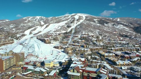 Aerial View Of Chairlifts And Hotel Buildings Near Ski Resort By The Mountain In Steamboat Springs, Colorado.