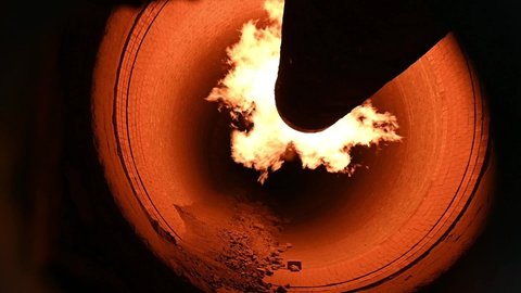 Flame in rotary kiln, cement plant, in slow motion during clinker production process HD.