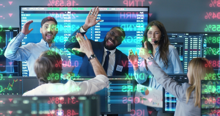 Mixed-races happy cheerful males and females brokers smiling and giving fives to each other after success in trading. Exchange office with monitors and rates. Multiethnic traders celebrating concept Royalty-Free Stock Footage #1077646931