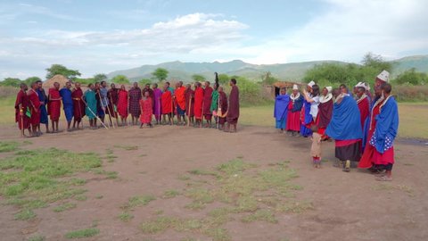 Baraka Emanyata Masai Village. Tanzania. 18.03.2021 African Maasai tribe  in traditional folk costumes performing a ritual dance. Editorial