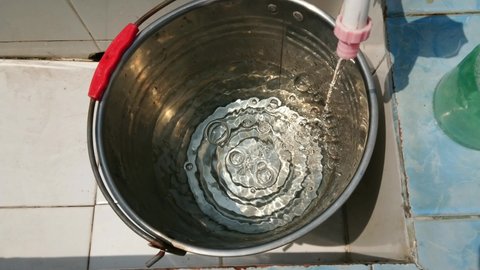 The Process of Filling Water into the Bucket.