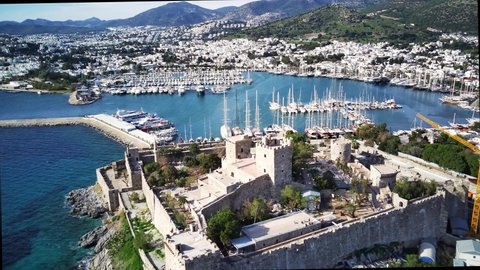 Amazing panoramic view from drone of beautiful full of yachts Bodrum harbour and ancient Kalesi castle in Mugla province in Turkey