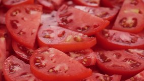 Tomato salad. Pour olive oil on sliced tomatoes, rotation. Healthy food concept. 4K UHD video