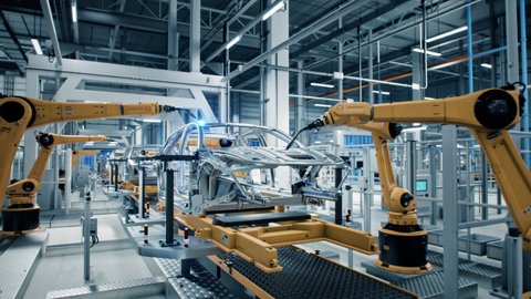 Car Factory 3D Concept: Automated Robot Arm Assembly Line Manufacturing Advanced High-Tech Green Energy Electric Vehicles. Construction, Building, Welding Industrial Production Conveyor. Close-up
