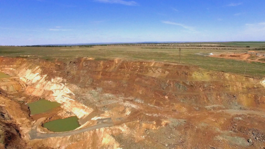 Aerial view of an industrial explosion in an alumina quarry.