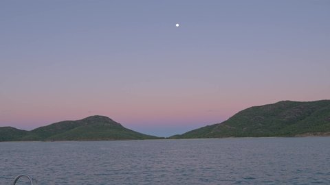 Colorful Horizon At Burning Point Anchorage At Shaw Island During Twilight Hour In Whitsunday, QLD, Australia. - wide shot