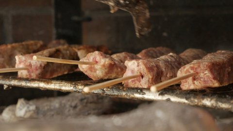 Juicy And Meaty Romanian Kebab Being Cooked On Charcoal Grill. - Closeup Shot