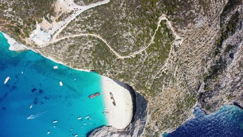 Aerial View Of Tourists Enjoying Navagio Beach In Summer - Popular Tourist Attraction In Zakynthos, Ionian Island, Greece.