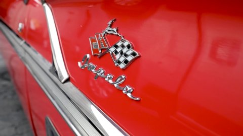 Sandy , Utah , United States - 08 01 2021: Red Convertible 1958 Chevrolet Impala Logo And Emblem