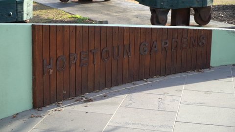 Melbourne , Australia - 08 01 2021: Logo direction sign of Hopetoun Gardens, dolly forward view