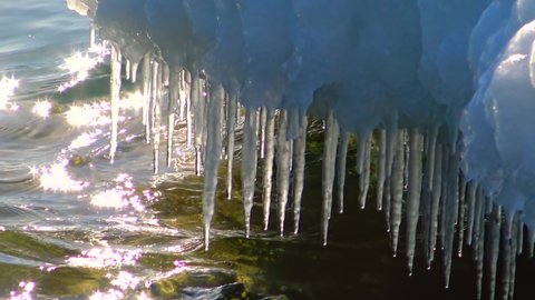 Ice icicles glisten in the freezing Black Sea, Ukraine