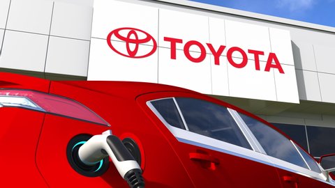 TOYOTA logo and the electric car plug. Editorial conceptual 3d animation