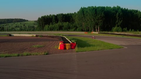 Kart racing on circuits, aerial view 4k video. Sports car for karting moving on racetrack. Rally, speed concept